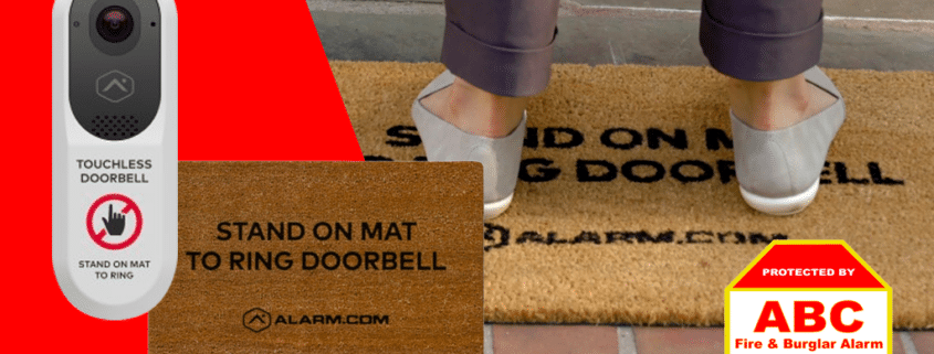 video doorbell product and door mat and person standing on door mat